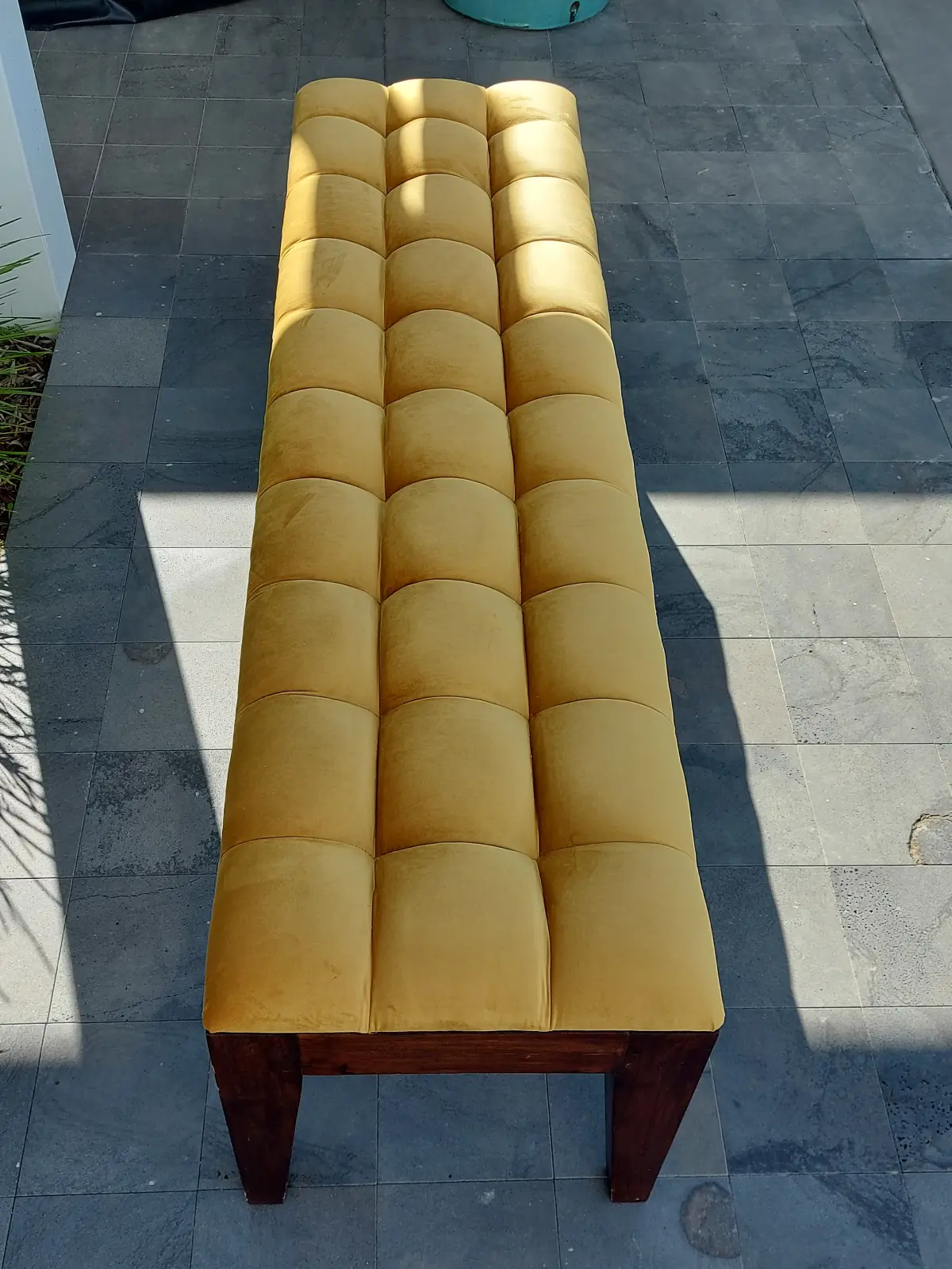 Mustard velvet bench viewed from above