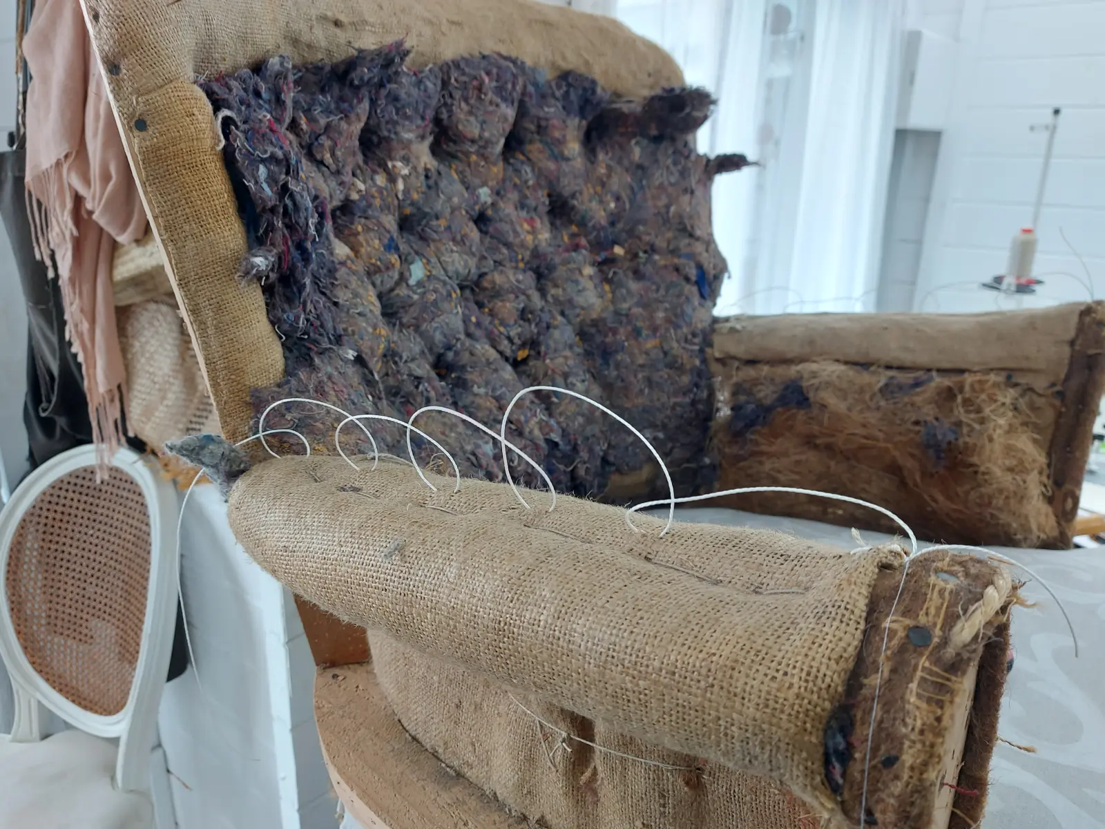 Traditional upholstery materials and hand stitching in progress